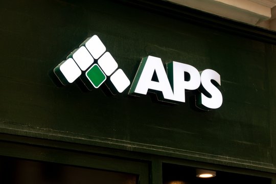 The logo of Maltese APS Bank above entrance to a office where banking services for customers are provided