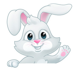 Obraz na płótnie Canvas Easter bunny rabbit cartoon character peeking over a sign background and waving