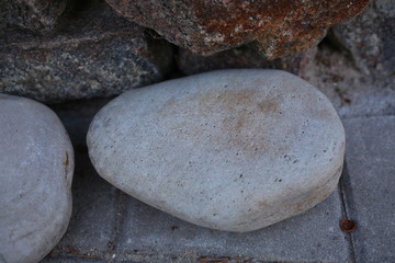 large brown stones, texture, outdoors in summer