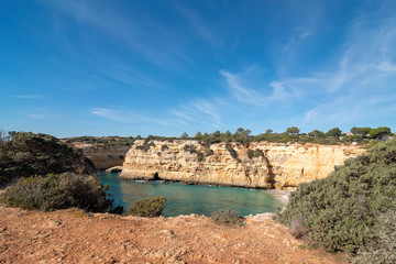 high cliffs on the shore of the Atlantic Ocean. Portugal. Algarve.