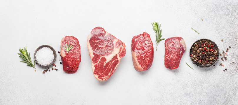 Variety of raw beef steaks