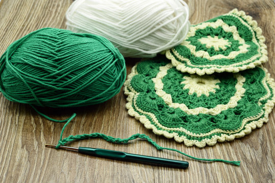 Traditional Crochet Oven Gloves Made Of Green And Beige Wool.