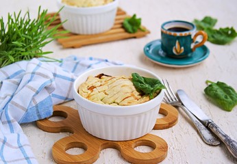Portioned traditional Italian Easter cake or tart with spinach, ricotta and whole eggs. Italian food. Dishes Easter. Baking with greens.
