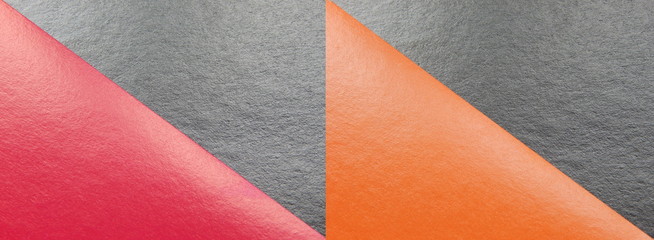 Abstract background with four triangles - red, orange and two black, the texture of the paper.