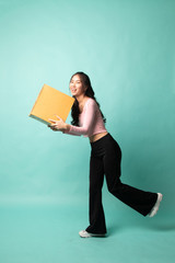 Delivery, relocation and unpacking.  young asian woman holding cardboard box.