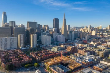Gardinen San Francisco aerial view of downtown at sunrise. Drone view facing downtown. Blue sky, golden light copy space in sky. Embarcadero and North Beach area in foreground. © Patrick