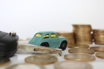 Miniature people with coins and car. Miniature businessman walking through a toy car. Concept of financial, retail, money saving and business. Turkey car price infilation. Car mortgage related