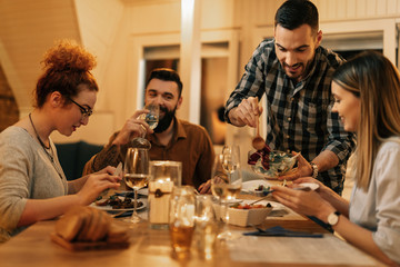 Here, I'll pour you some more salad!