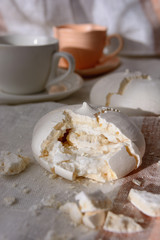 Fototapeta na wymiar Classic meringue cookies for tea or coffee, vertical orientation