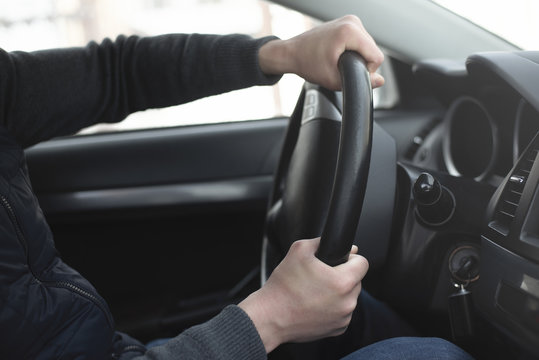 Driver Sharply Is Turning The Steering Wheel Close Up. Emergency Stop.