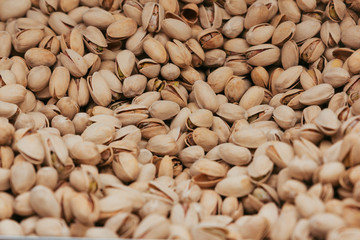 Stock photo of a close shot of pistachios in a market stand