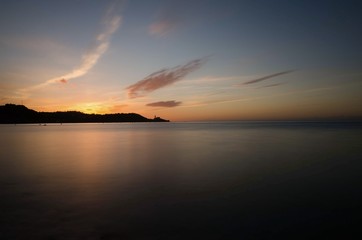 Naklejka premium Sunset behind Piran with golden sun, Slovenia