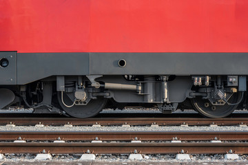 Locomotive wheels on railway tracks. Train wheels close-up on tracks