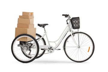 Studio shot of a tricycle with pile of boxes