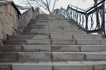 Obraz premium Stone stairs on the promenade of the city.