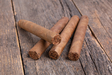 Cigars on a wooden background close up