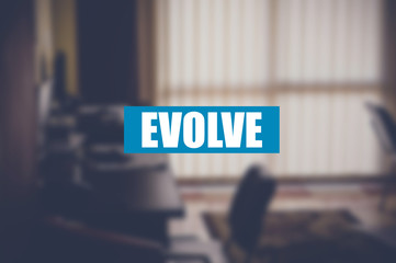 evolve word with business blurring background
