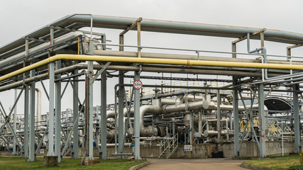 Industrial oil product storage tanks and pipelines at the oil product terminal.