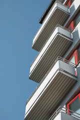 Balconies on a modern apartment building against the blue sky.