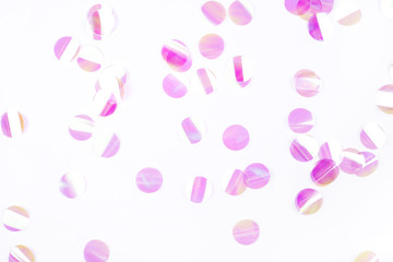 Pearl confetti on white background. Flat lay, top view.