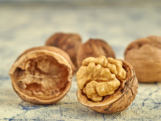 Walnuts lie on a light colored background