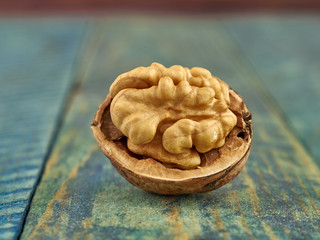 Walnuts lie on a light colored background