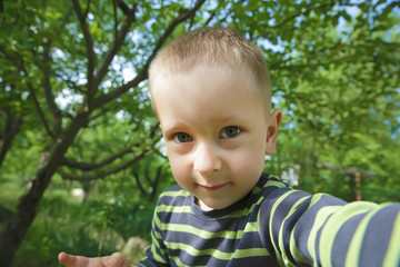 Portrait of the little boy outdoors