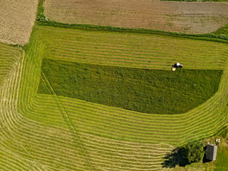 Work tractor in the field aerial view.