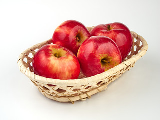 Bright beautiful red apples on a colored background