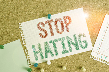 Conceptual hand writing showing Stop Hating. Concept meaning to drop all standards and...