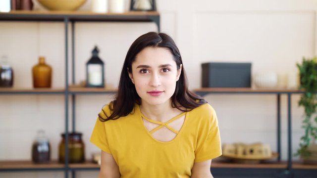 Angry girl showing fuck you and expressing negative emotions at home