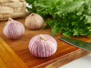 Fresh garlic on market table closeup photo