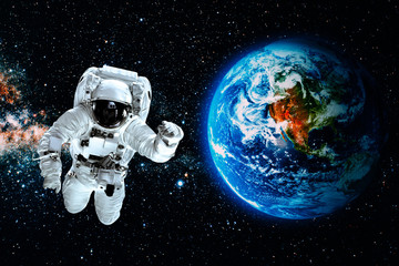 astronaut flies over the earth in space. Elements of this image furnished by NASA