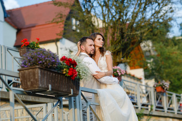 Bride and groom at sunset on a background of a village in Germany