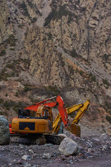 Two excavators digging ground together © sergograph