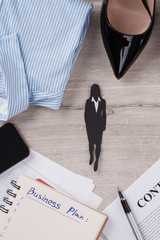 Figure of businesswoman in focus. Contract, pen and planner. Woman in business.