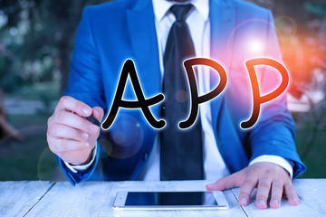 Handwriting text writing App. Conceptual photo Computer program Download software by a user to a mobile device Businessman holds pen and points into copy space