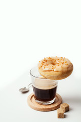 Glass of coffee and doughnut