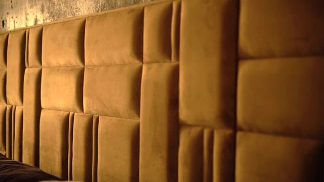 Upholstered luxury box bed headboard design, pattern and texture.