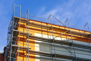 house facade renovation and thermal insulation, scaffolding