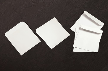 White envelope and post card on background. Top view blank envelope mockup and blank letterhead...