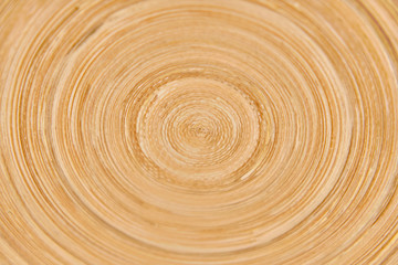 Texture of a round ornament on a wooden board, rotation background with a wood pattern