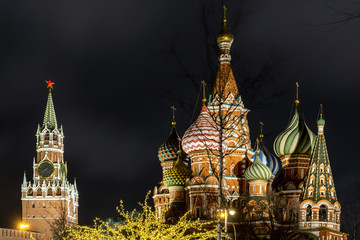 Spasskaya tower of the Kremlin and St. Basil's Cathedral in night - Moscow, Russia, 17 01 2020