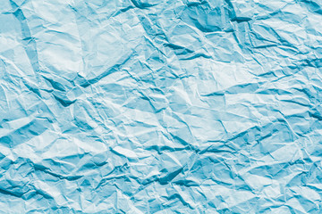 Crinkled winter cool blue paper texture background