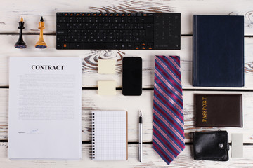 Passport, wallet and diary. Stationery, signed contract and devices. Businessman layout.