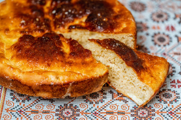 delicious cut pie on the tablecloth