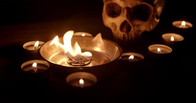 Burning pentacle on altar closeup footage