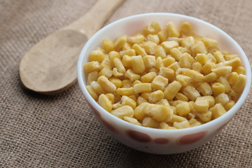 close up of sweet corn in a bowl on table 