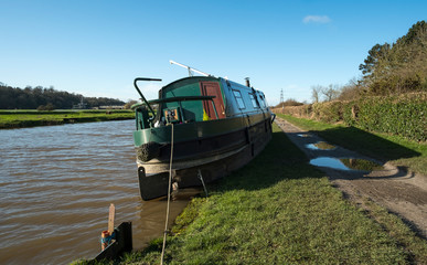Fototapeta na wymiar Stern of a stranded canal boat