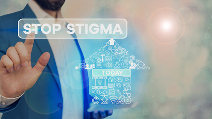 Conceptual hand writing showing Stop Stigma. Concept meaning end the feeling of disapproval that...